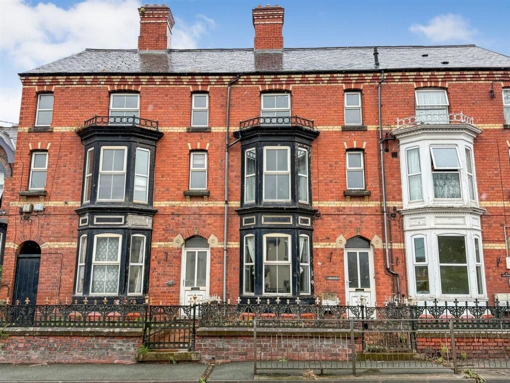 Spacious Four-Bedroom Mid-Terraced Property Requiring Renovation