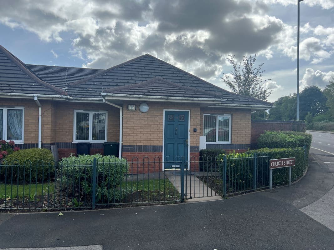 A vacant freehold end terraced bungalow