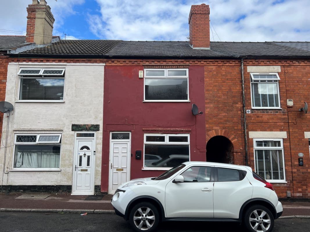 Vacant Freehold Mid Terraced Property