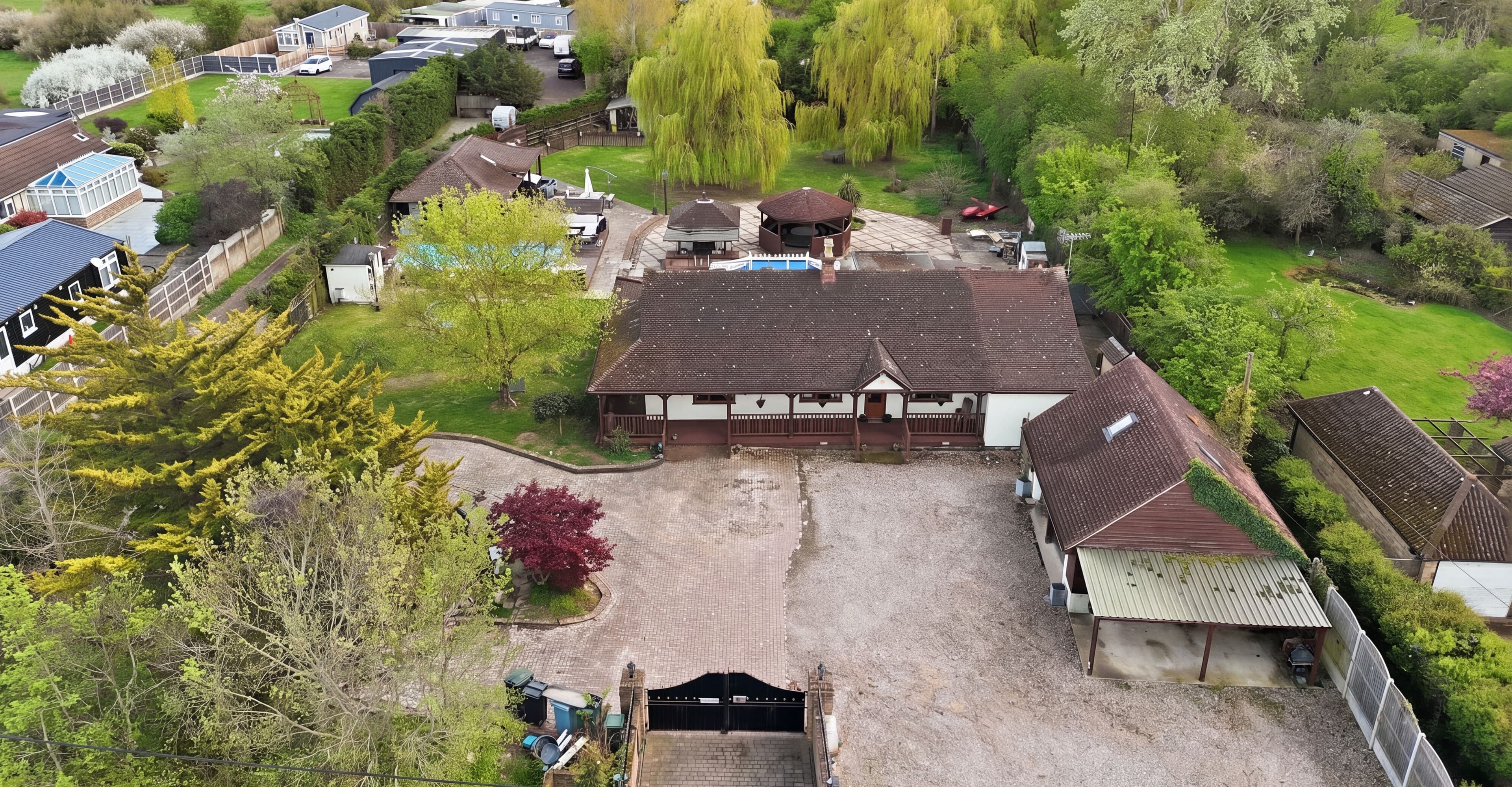Residential Investment: Substantial Four-Bedroom Home Set in Private Grounds