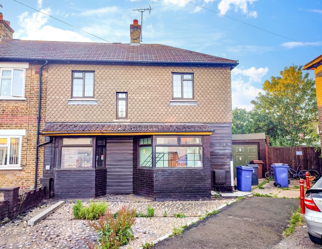 Freehold Semi-Detached House and Detached Garage Vacant Possession