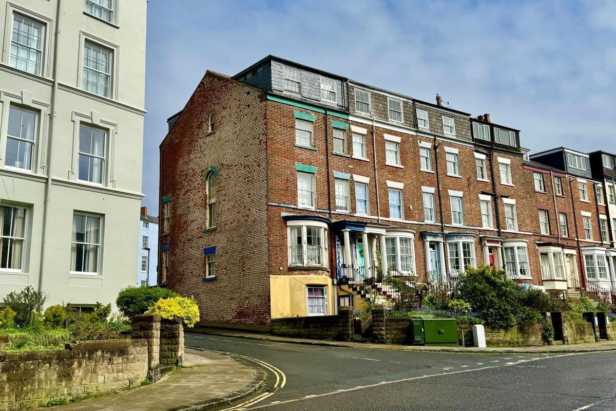 A freehold end terrace house in Scarborough configured as four, two-bedroom tenanted flats with a gross annual yield of 10.9%.