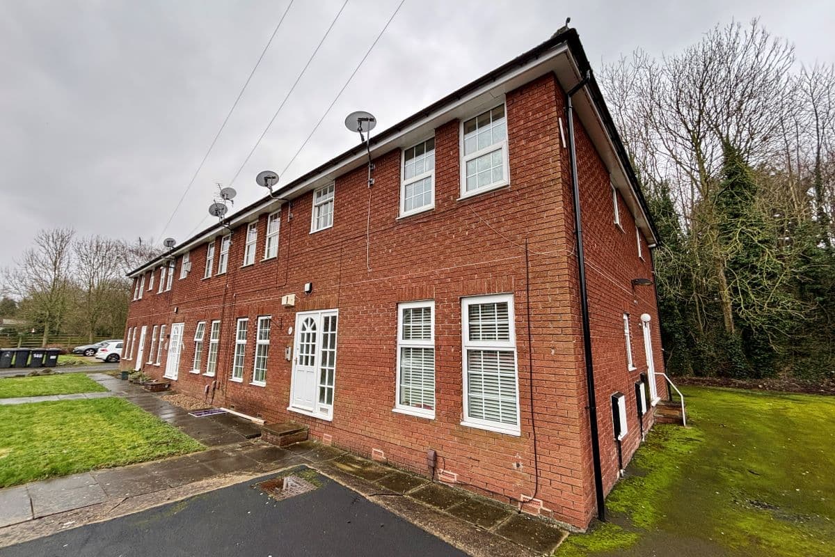 A purpose-built, vacant, low leasehold, first-floor flat with parking