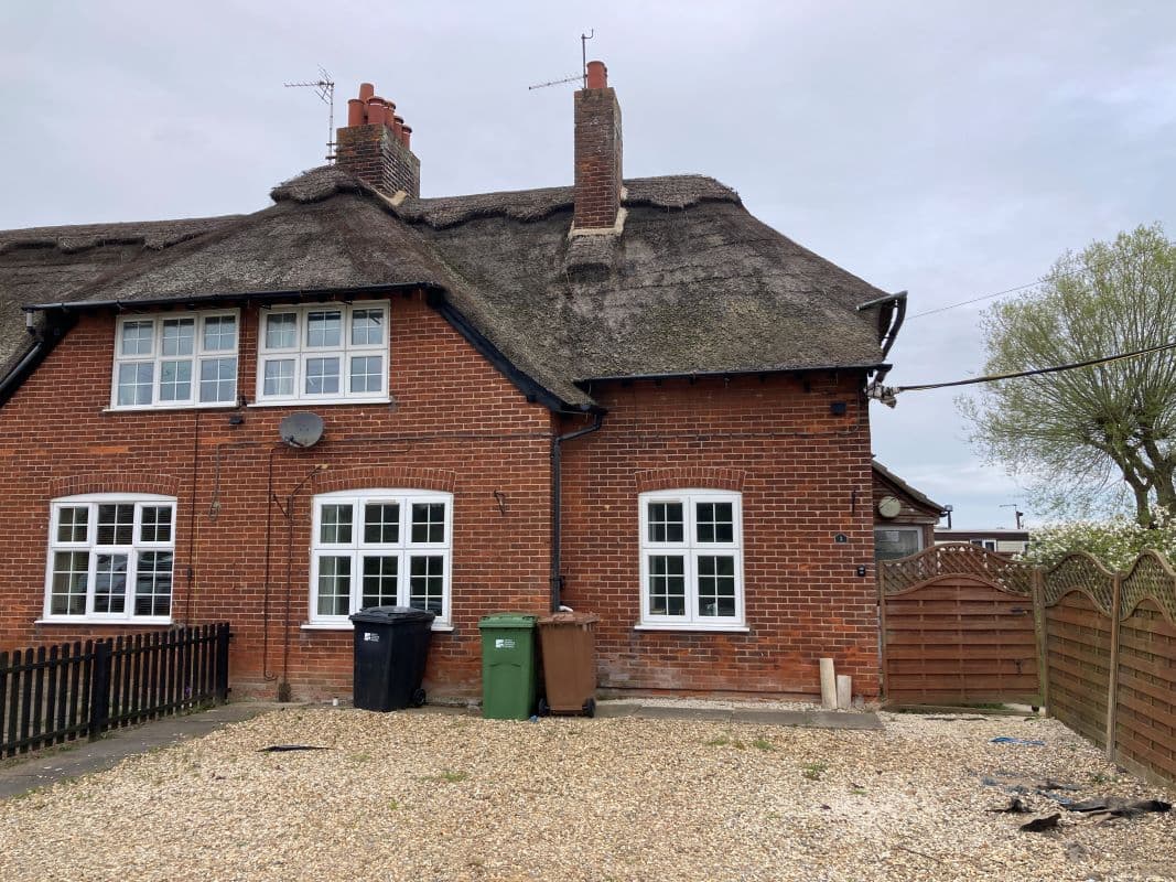Older Style Thatched End Terraced House