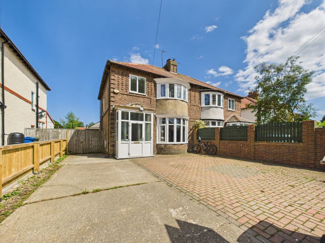 A large three-bedroom semi-detached house in need of renovation.