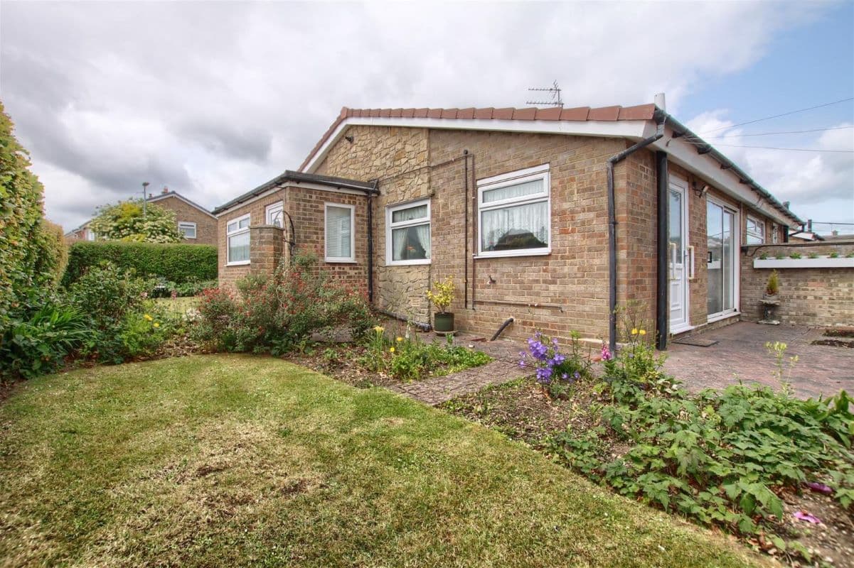Deceptively Spacious Bungalow on a Corner Plot