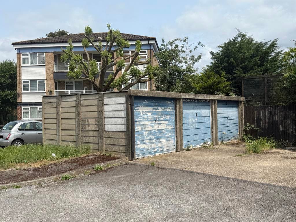 Six Garages In Two Blocks Of Three In Residential Area