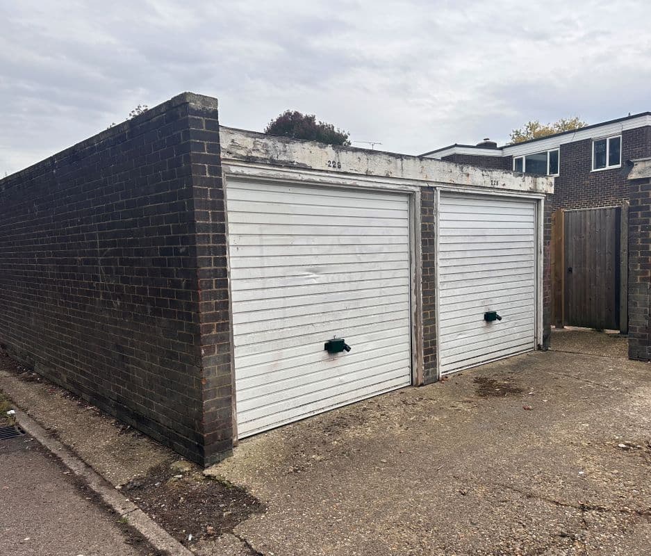 Freehold Site with 11 Garages and 11 Parking Spaces