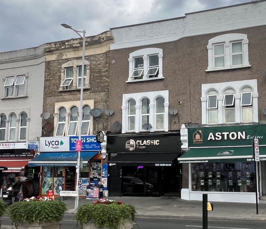 LEASEHOLD SHOP AND TWO FLATS PRODUCING £46,600 PER ANNUM