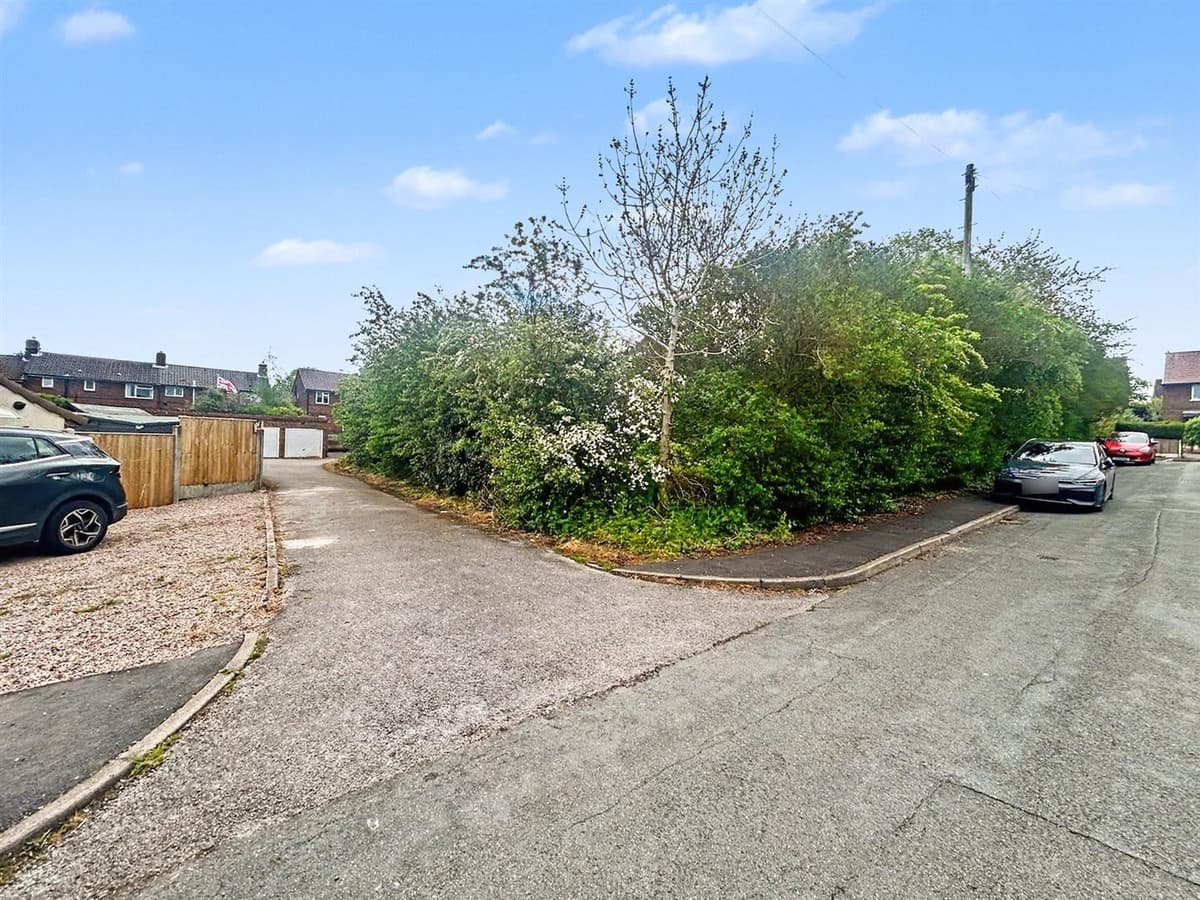 Land comprising 6 domestic garages