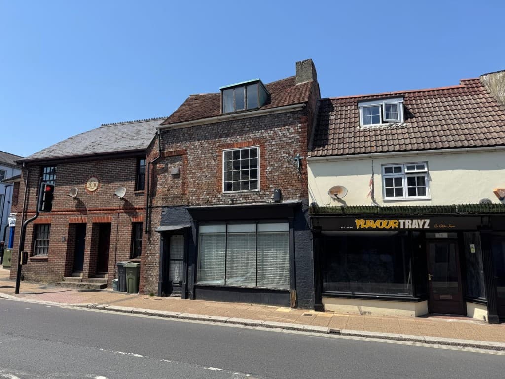 Freehold Three Storey Town Centre Building With Potential