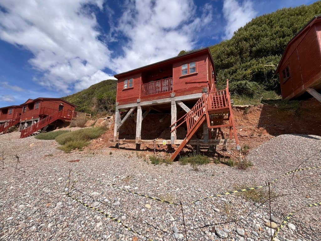 Structurally Damaged Beach Hut In Beach Location, For Repair